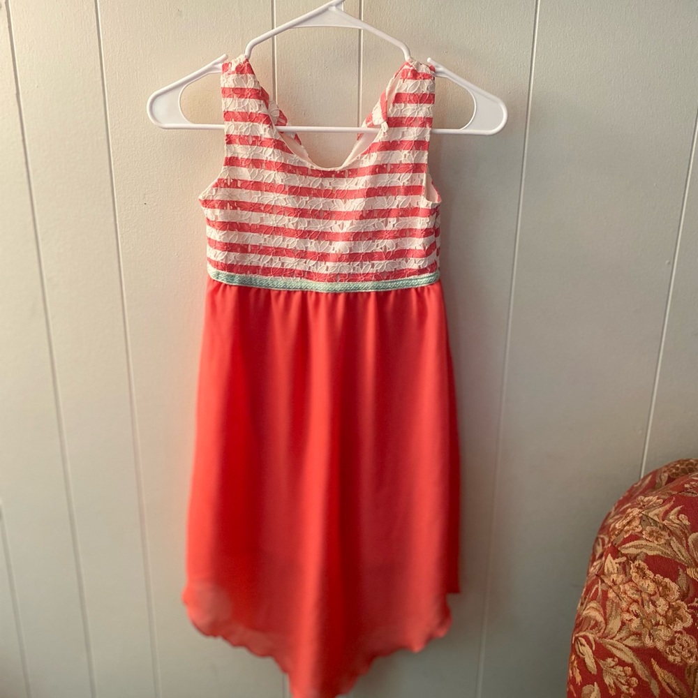 girls medium dress , tag taken out , left holes but can't see on the outside